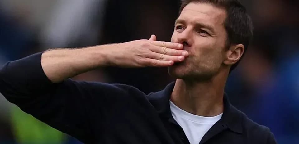 Manager blowing a kiss to the crowd