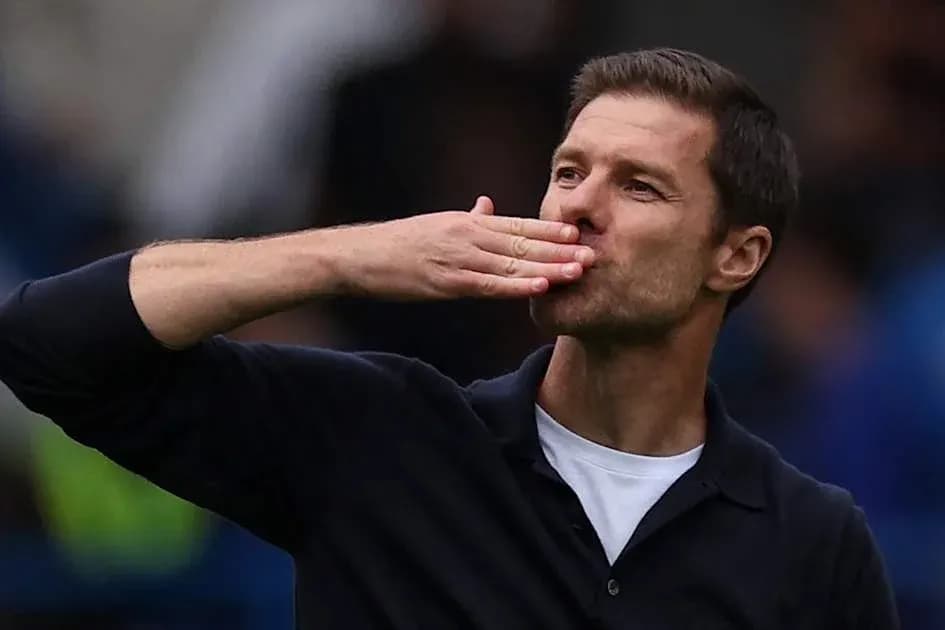 Manager blowing a kiss to the crowd