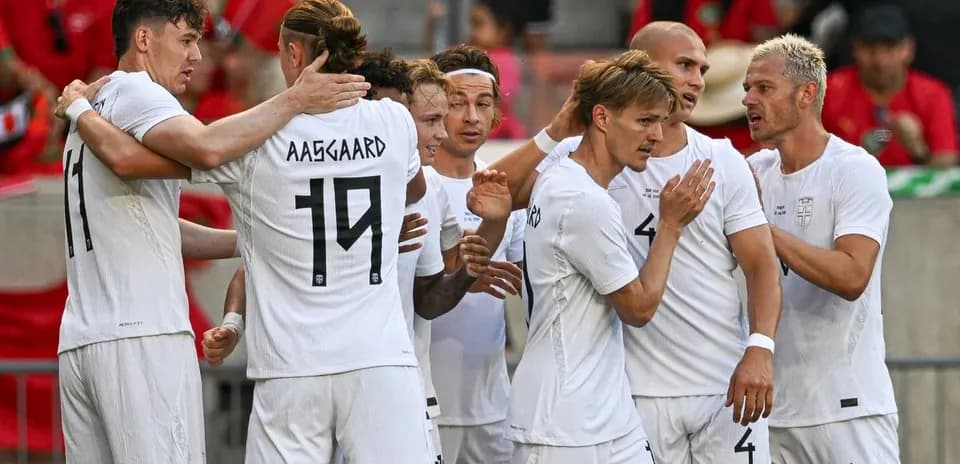 Players celebrating together after scoring a goal