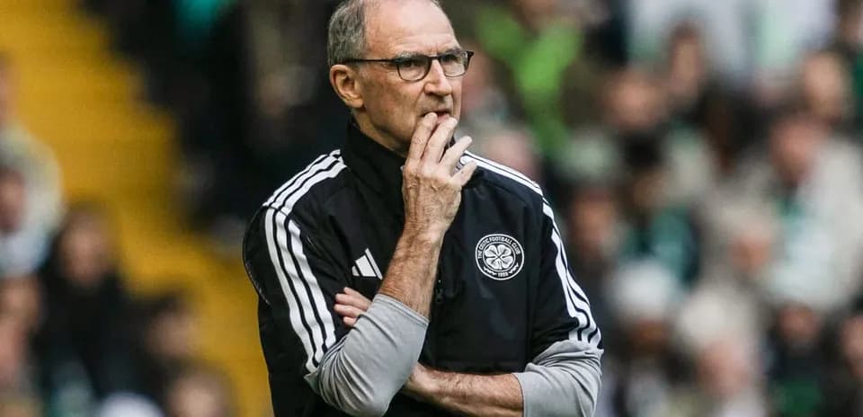 Manager observing the match with arms crossed
