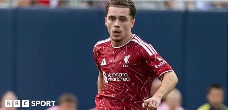 Player in red Liverpool kit running on field