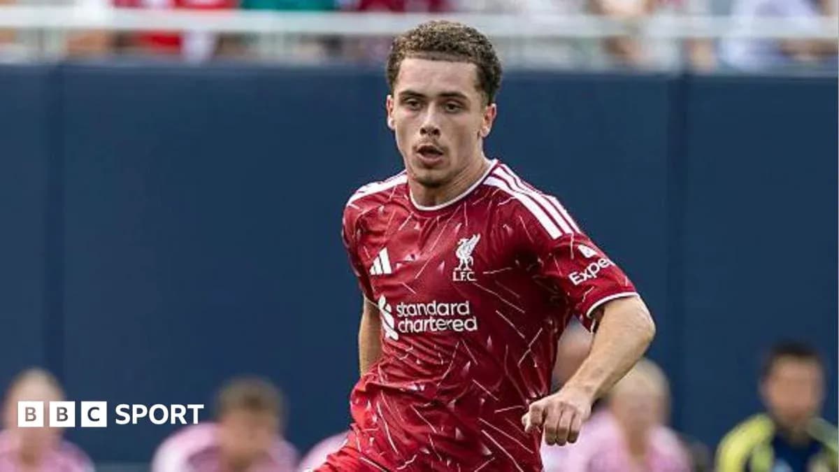 Player in red Liverpool kit running on field