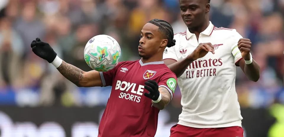 West Ham and Arsenal players battling for the ball