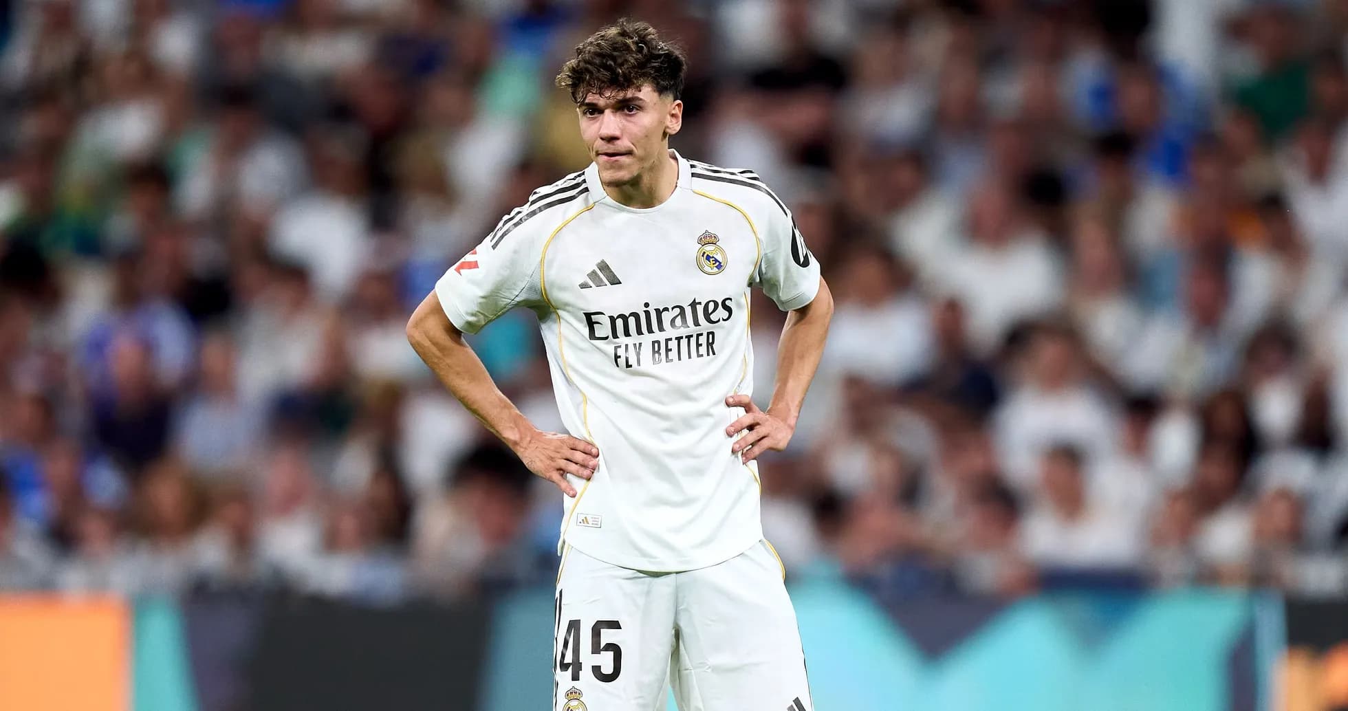 Real Madrid player standing on field during match