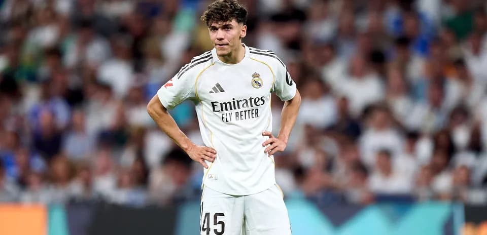 Real Madrid player standing on field during match