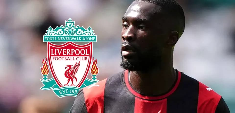 Player in red and black kit with Liverpool logo