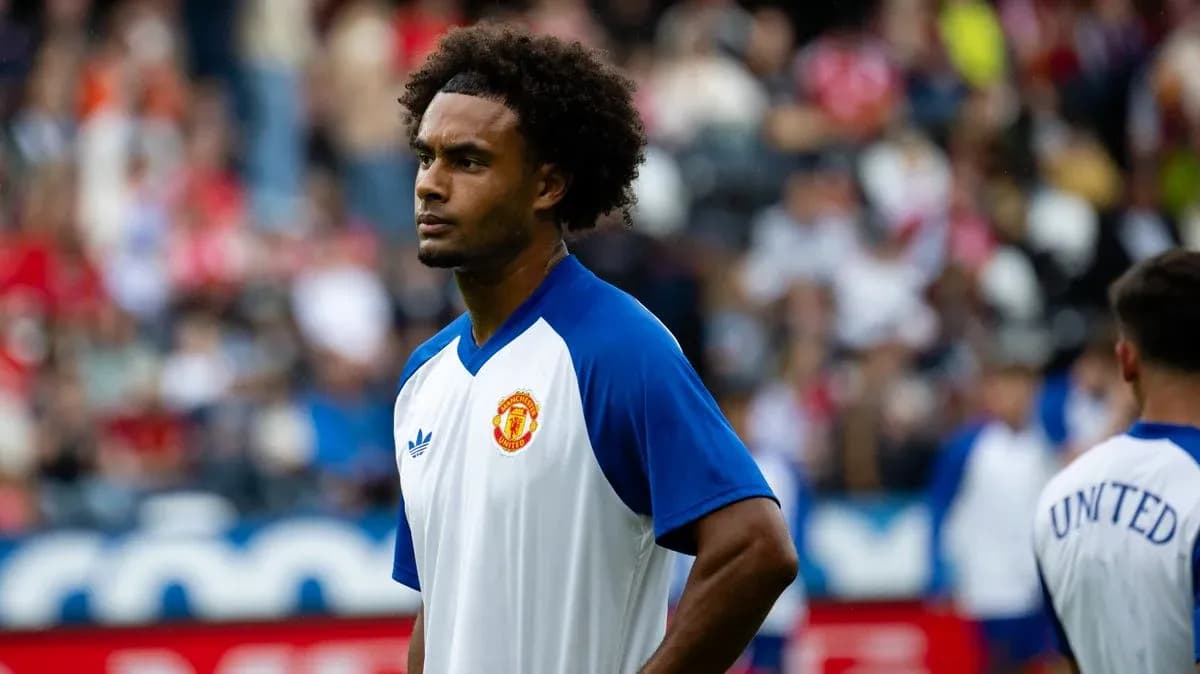 Player in Manchester United training kit during warm-up