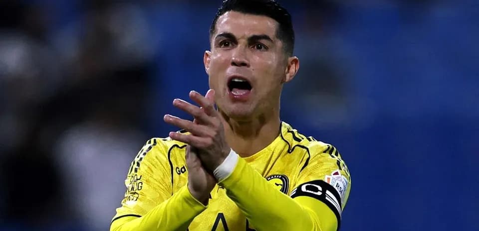 Player in yellow jersey gesturing during match