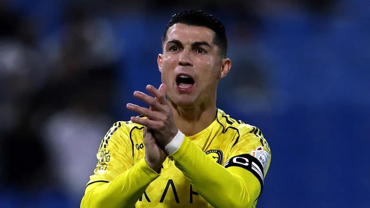 Player in yellow jersey gesturing during match
