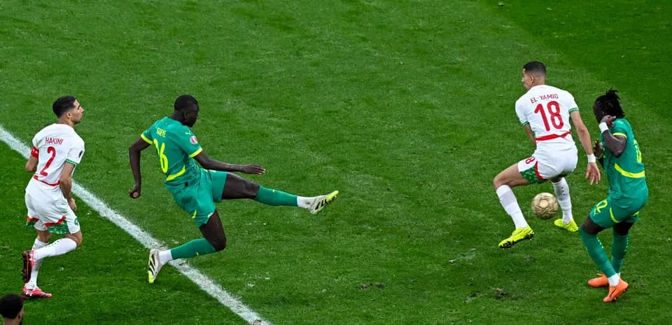 Players contesting the ball during a soccer match