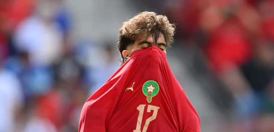 Player pulling shirt over head during match