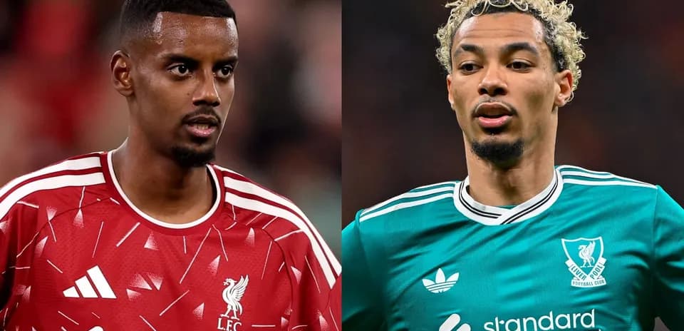 Two Liverpool players in training kits facing each other