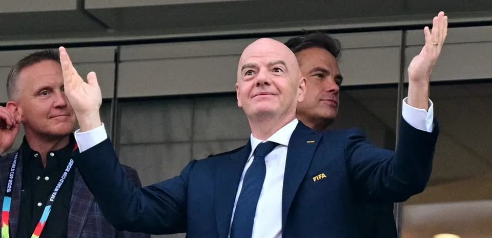 FIFA official gesturing during event in stadium