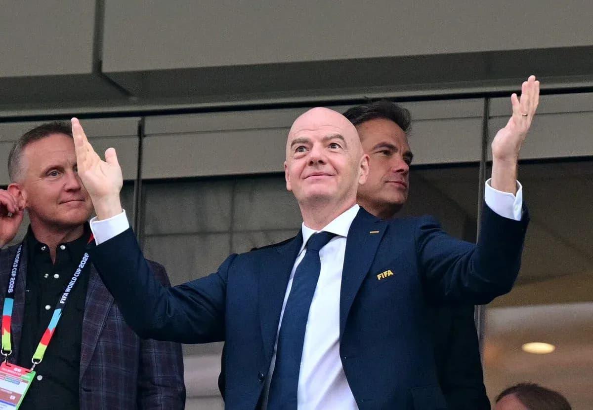 FIFA official gesturing during event in stadium