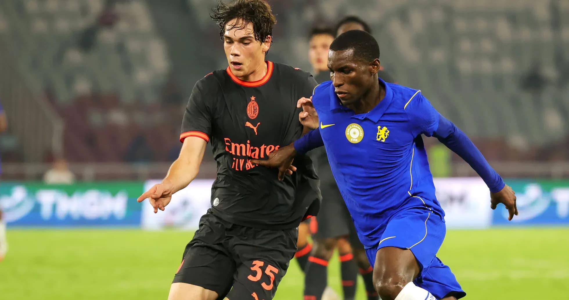 Two players competing for the ball during match