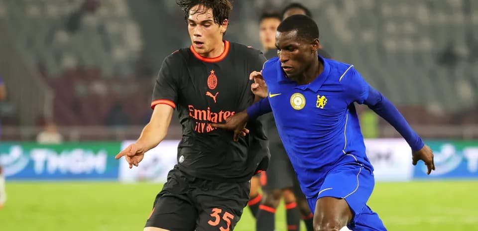 Two players competing for the ball during match