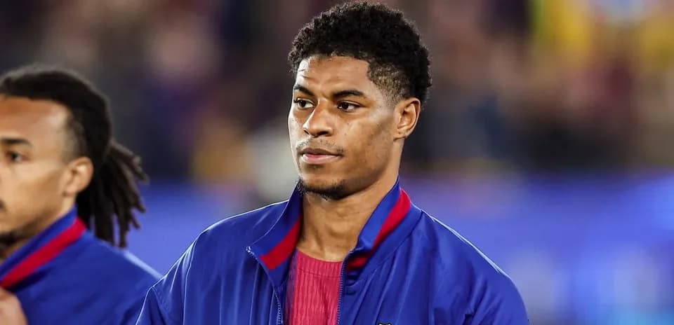 Player in FC Barcelona jacket during match warm-up