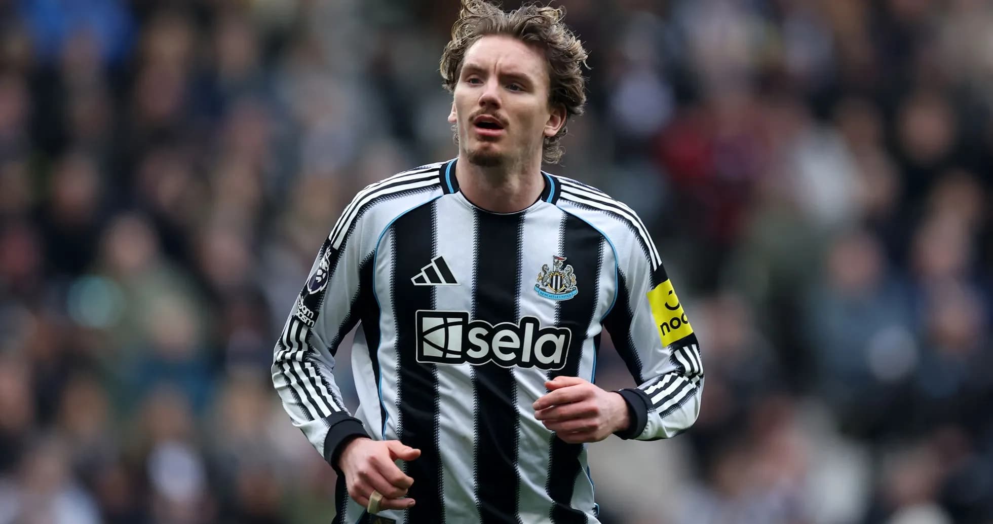 Player wearing Newcastle United kit on the pitch