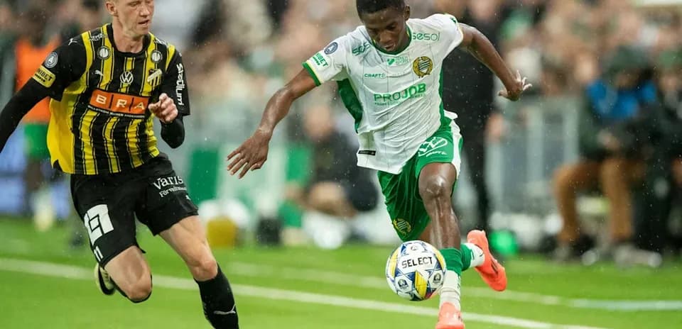 Player dribbling the ball past opponent during match