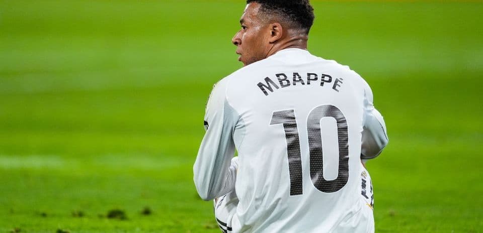 Player wearing jersey with name Mbappé and number 10