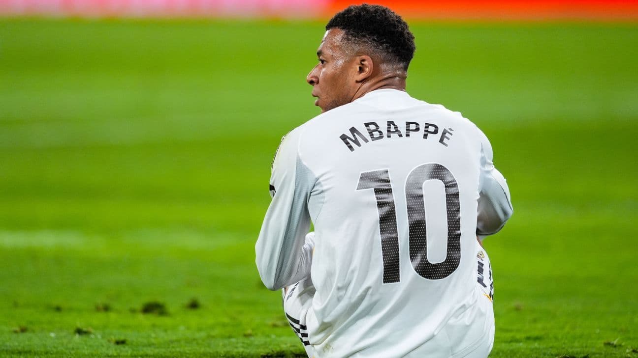 Player wearing jersey with name Mbappé and number 10