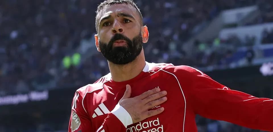 Player celebrating with hand on chest during match