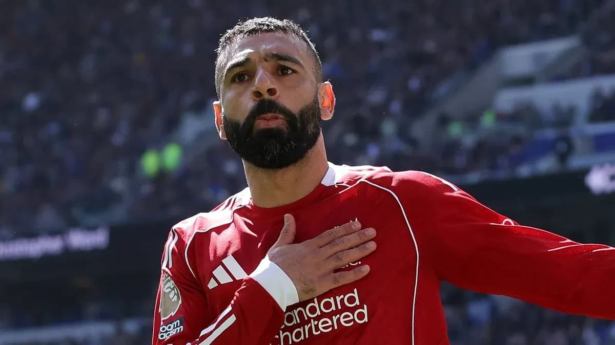 Player celebrating with hand on chest during match