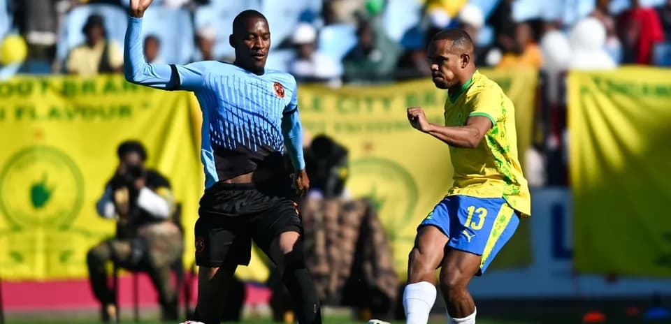 Player kicking the ball during a football match