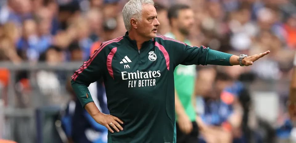 Coach giving instructions on the sidelines during match
