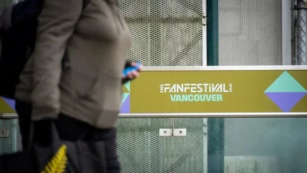 Person walking by Vancouver Fan Festival sign