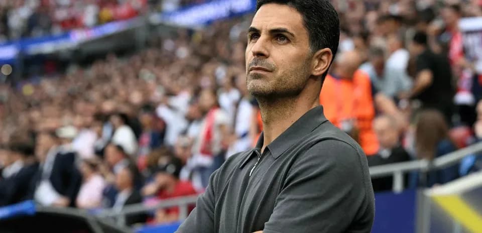 Coach observing match from the sidelines