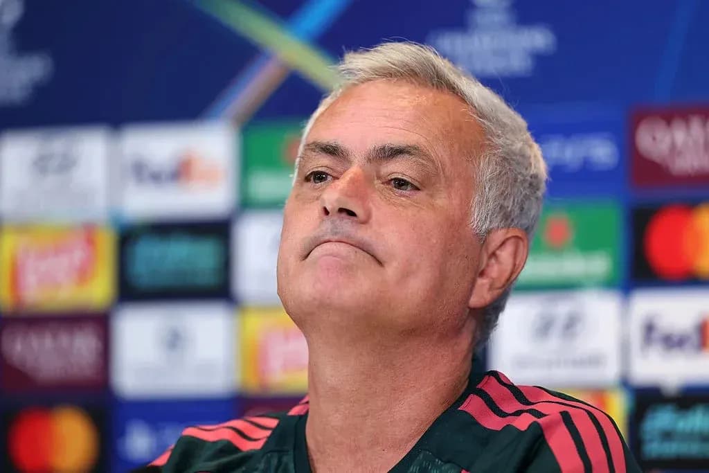 Manager speaking at press conference backdrop