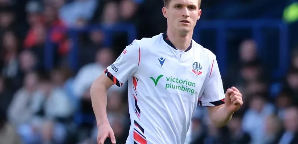 Bolton Wanderers player running on the field