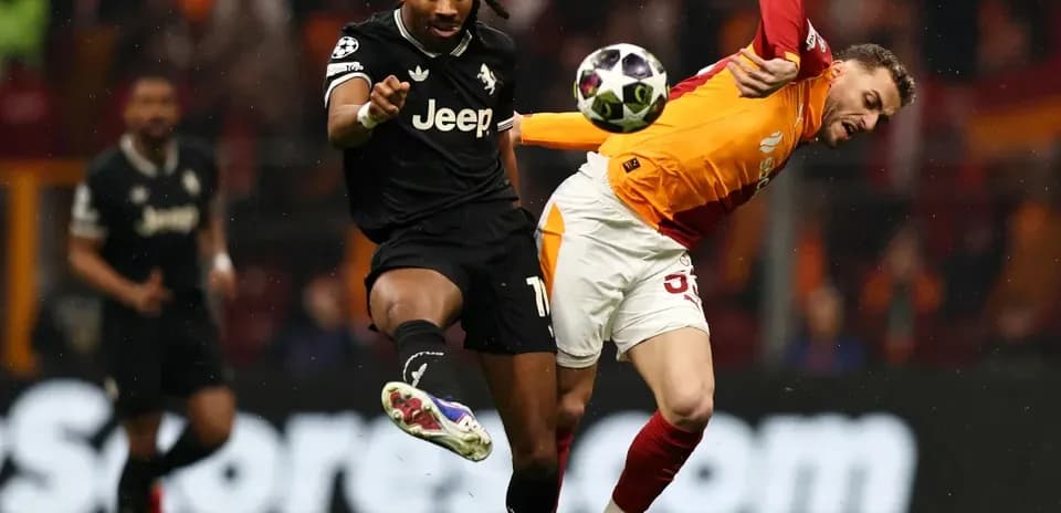 Players contesting for the ball during football match