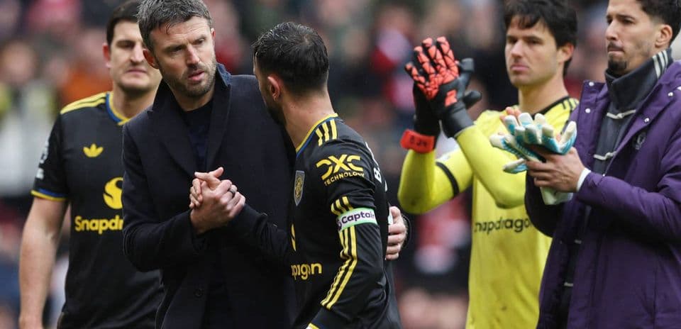 Manager shaking hands with player during substitution