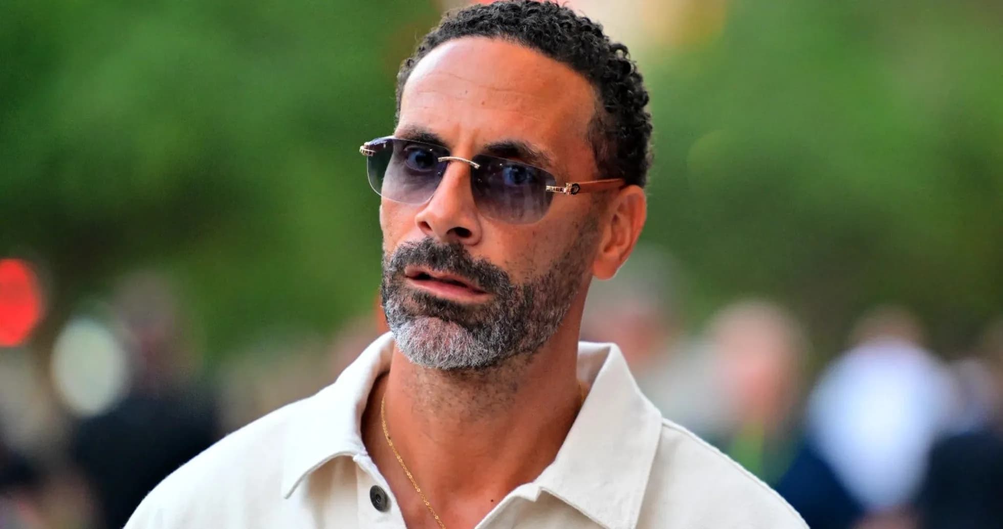 Man wearing sunglasses with a neutral expression