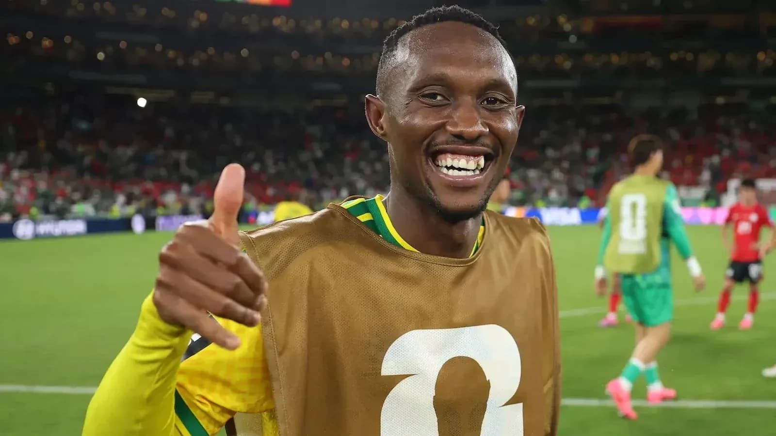 Player celebrating with a thumbs up on the field