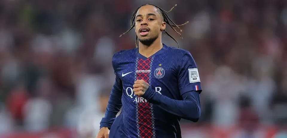 Player running in PSG jersey during match