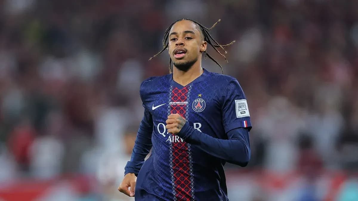 Player running in PSG jersey during match