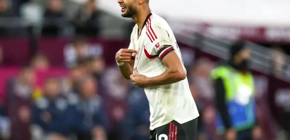 Player reacting during match wearing team jersey