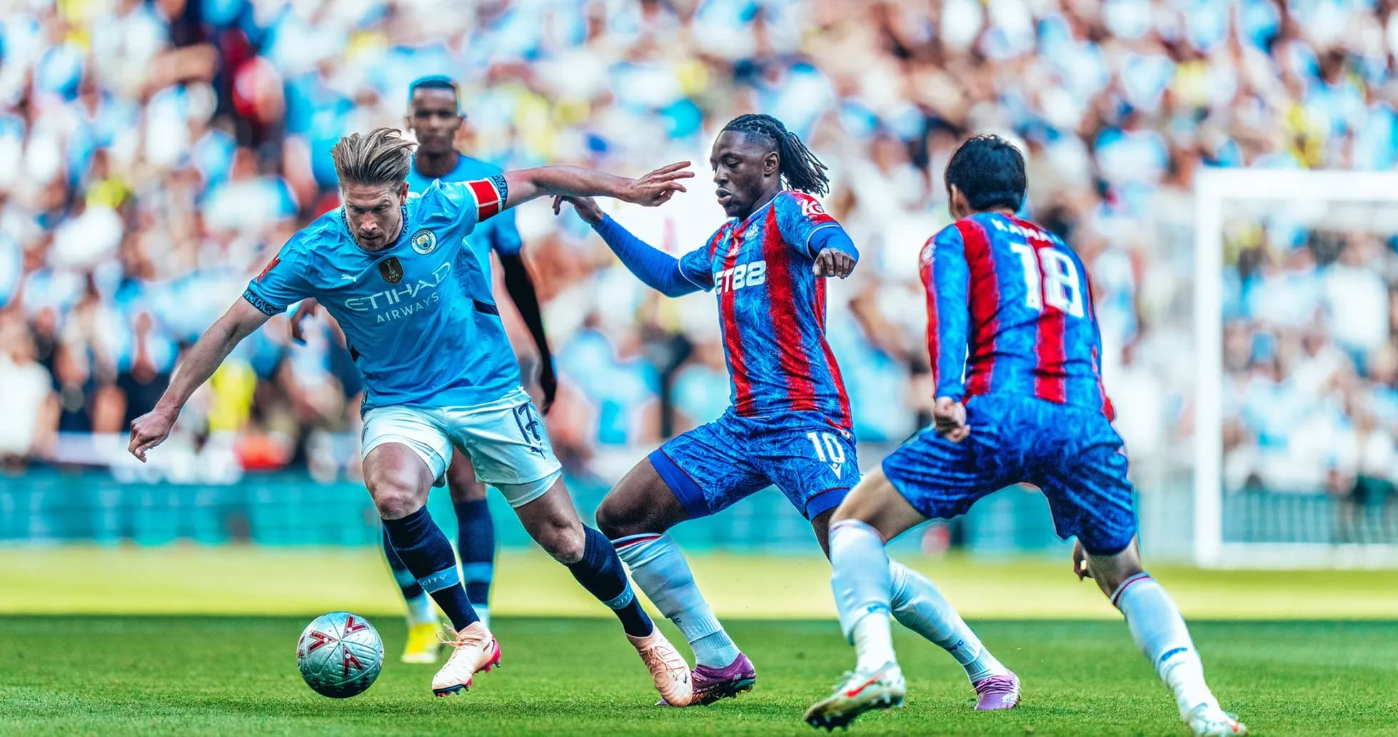 Manchester City players battling Crystal Palace opponents