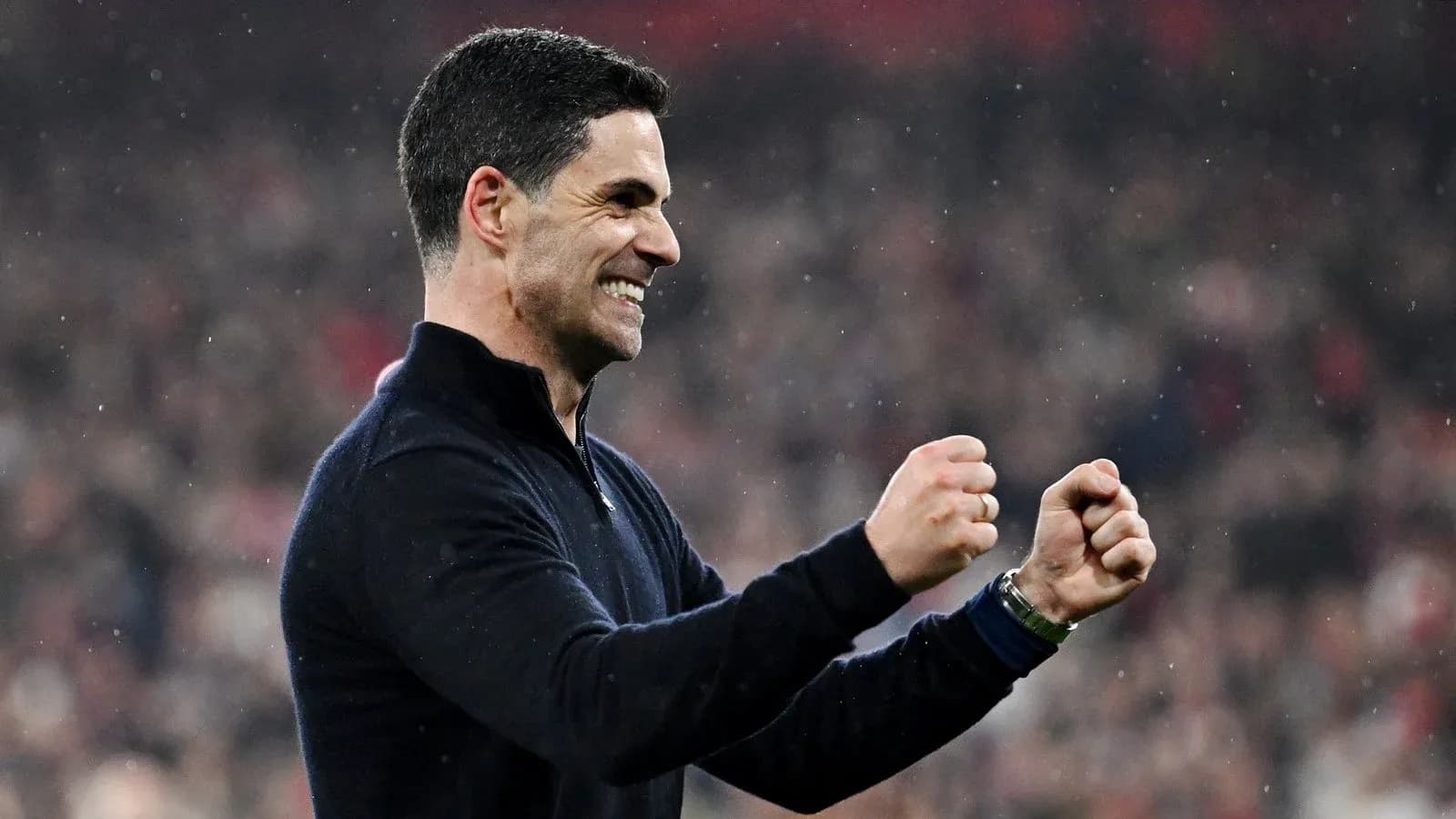 Manager celebrating victory with clenched fists