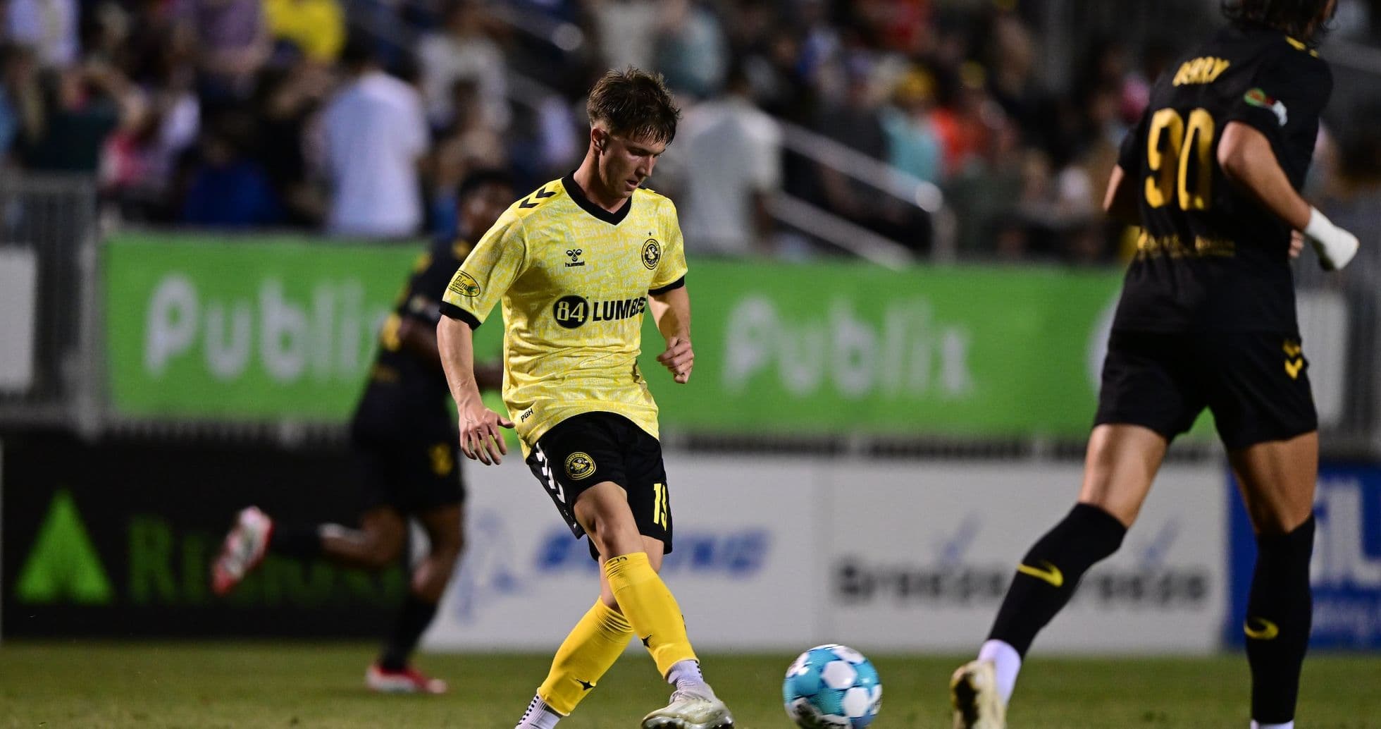 Player dribbling ball during Charleston Battery match