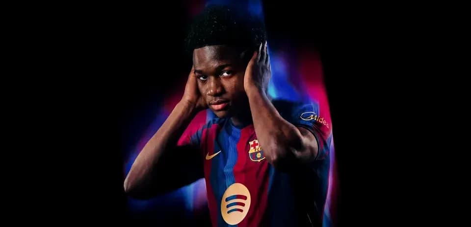 Player wearing FC Barcelona jersey, hands on head