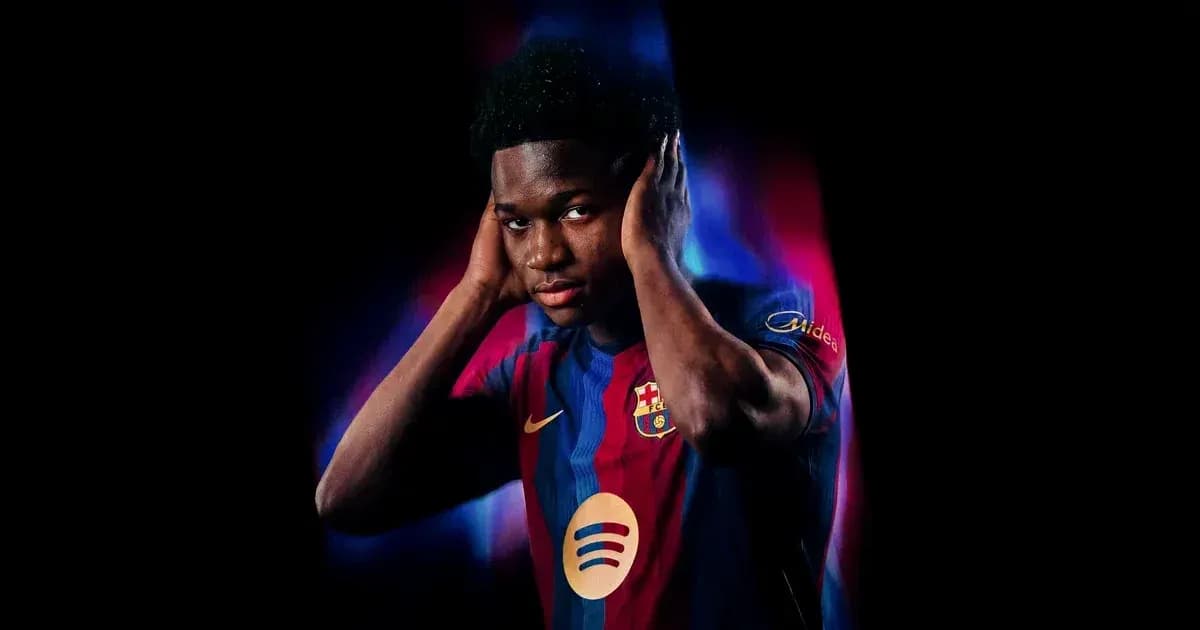 Player wearing FC Barcelona jersey, hands on head