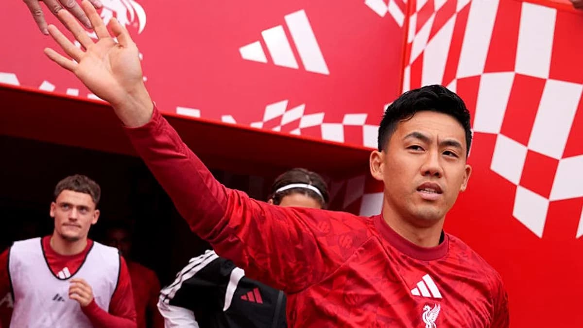 Player waving while exiting tunnel at stadium