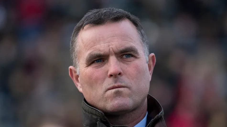 Man with serious expression in a crowd