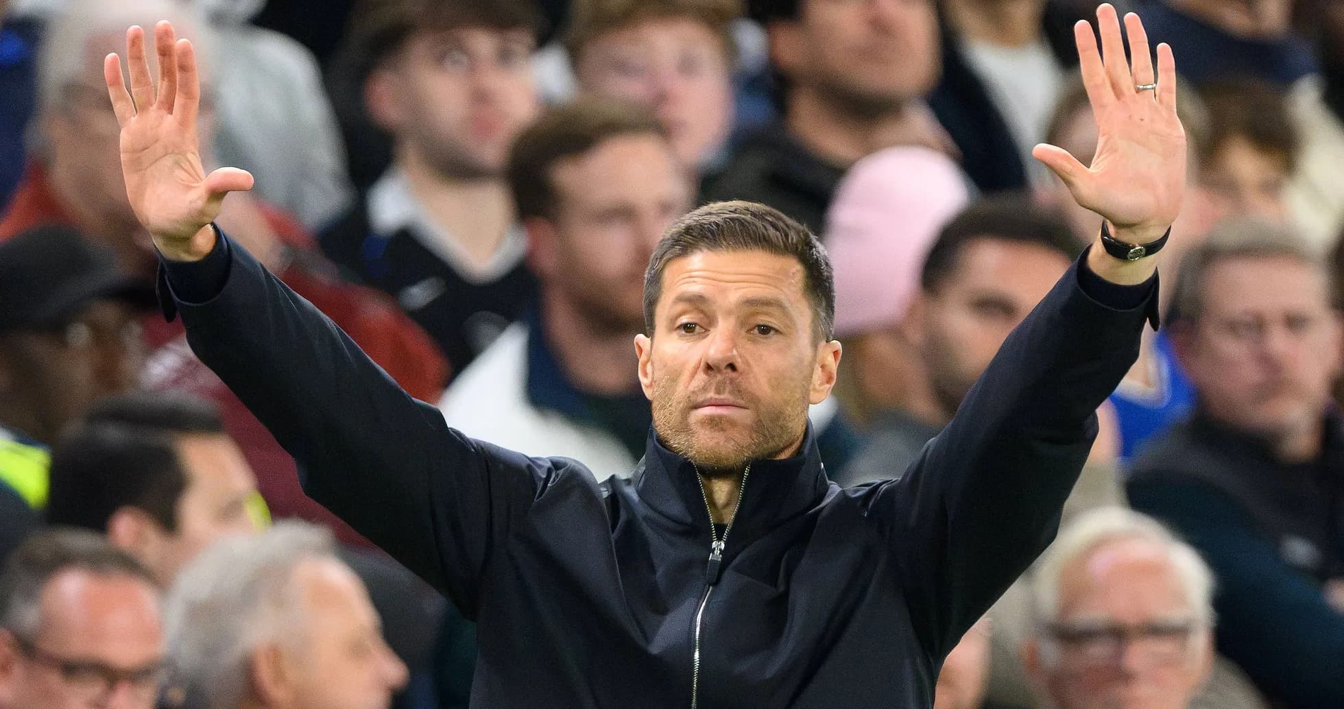Coach gesturing during a match from the sidelines