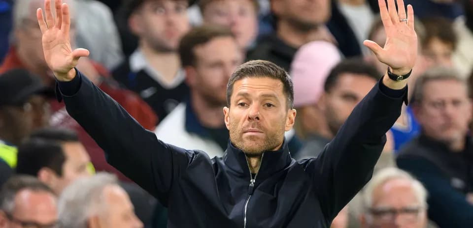 Coach gesturing during a match from the sidelines