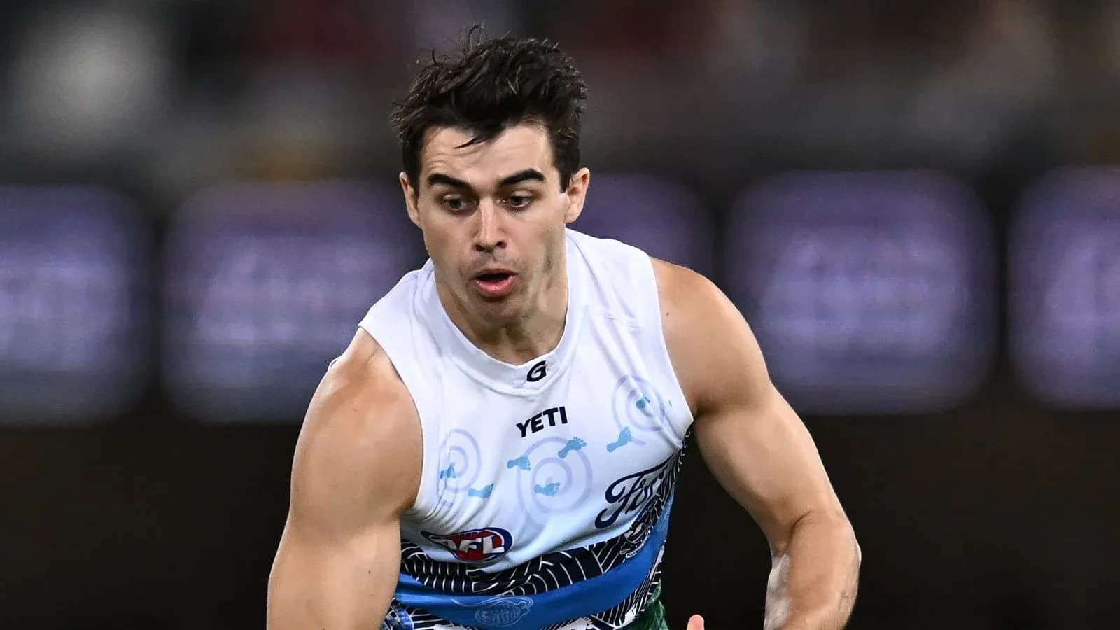 Player running during an Australian rules football match